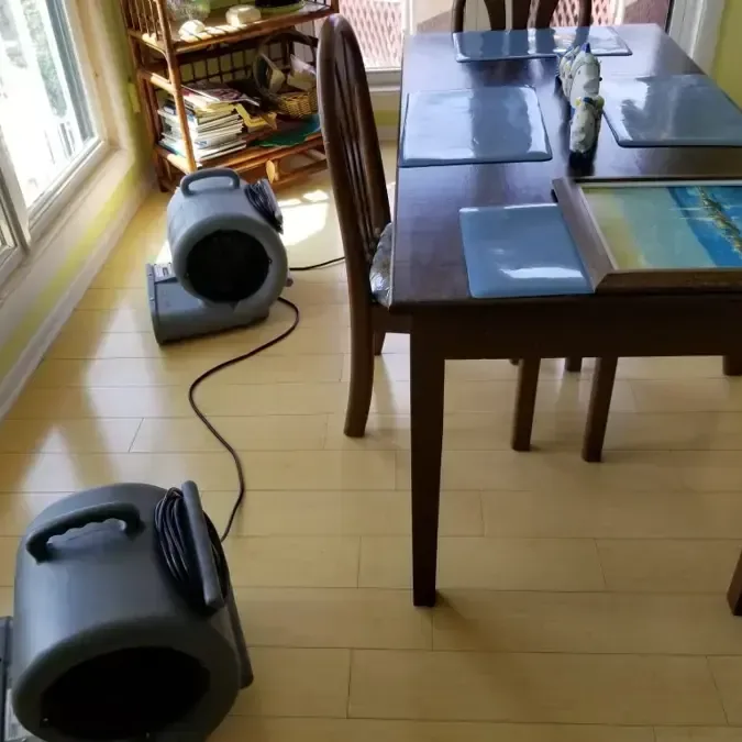 Two air movers beside a dining room table
